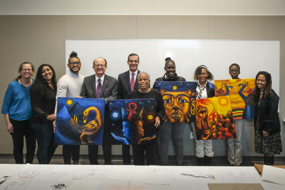 High school students with muralist Noni Olabisi, USC President Emeritus C. L. Max Nikias, and L.A. Mayor Eric Garcetti
