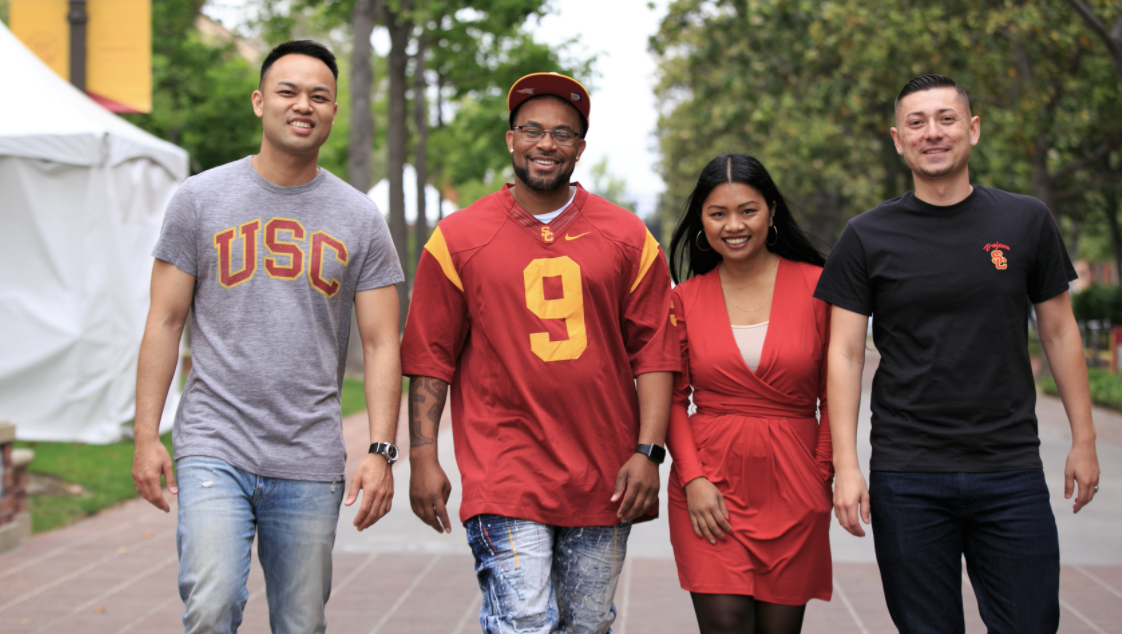 Four USC students walking together