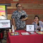 Volunteers accept tickets at entrance table